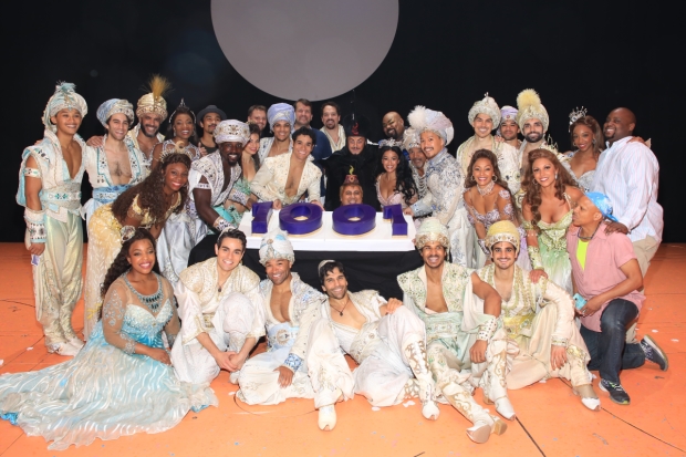 The cast of Disney&#39;s Aladdin pose with their cake.