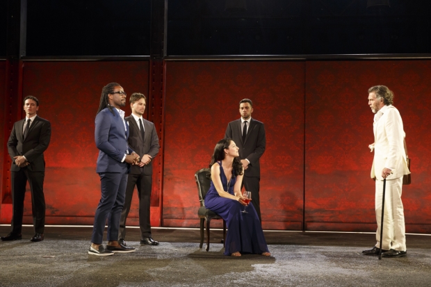 Helen (Tala Ashe, center) always has a glass of red wine on hand in Troilus and Cressida.