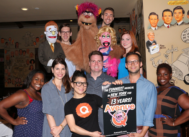 The current cast of Avenue Q celebrates at the Palm Restaurant.