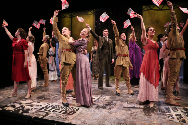 The young cast of Fiorello! waves American flags during the first-act finale.
