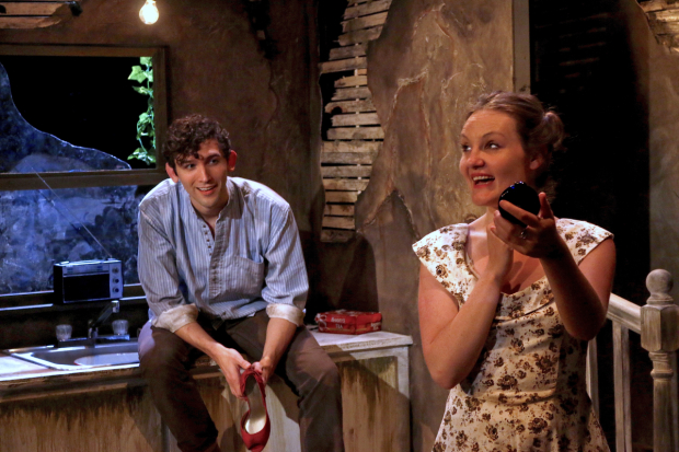 Young Rash (John Charles McLaughlin) and Dolly (Gina Costigan) share a flirty moment in Crackskull Row.