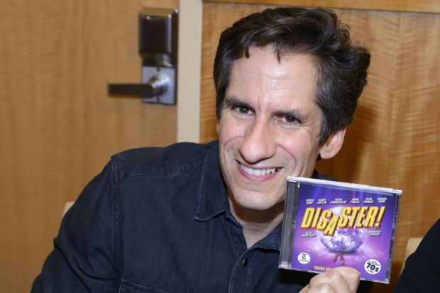 Seth Rudetsky shows off a copy of the new original cast recording of DIsaster!