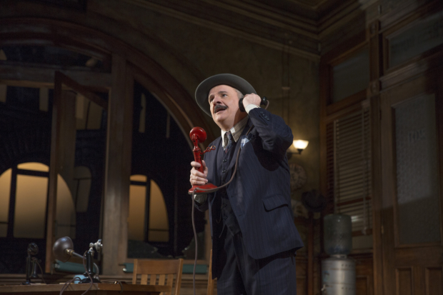 Nathan Lane plays Walter Burns in The Front Page.
