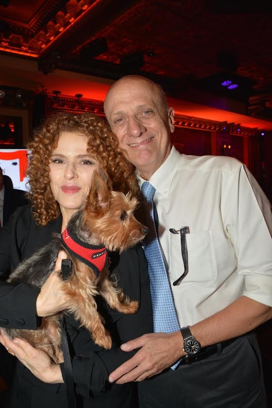 Bernadette Peters and honoree Tom Viola pose with a furry friend.