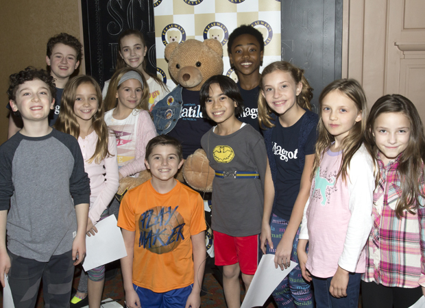 Children from Broadway&#39;s Matilda the Musical flank the Actors Fund&#39;s Ziggy Bear.
