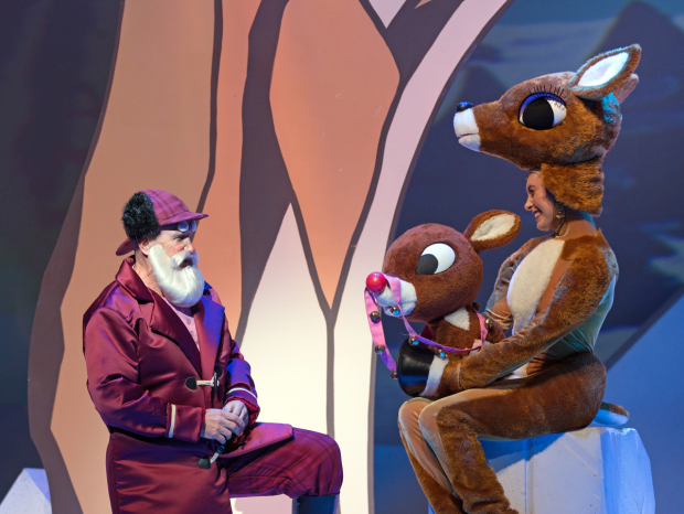 Santa (Doug LoPachin) chats with Mrs. Donner (Melissa Glasgow) in Rudolph the Red-Nosed Reindeer: The Musical.