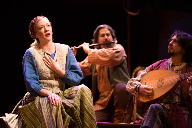 Emily Noël sings a festive tune played by musicians Daniel Meyers and Brian Kay in The Second Shepherds' Play, directed by Mary Hall Surface, at Folger Shakespeare Theatre.