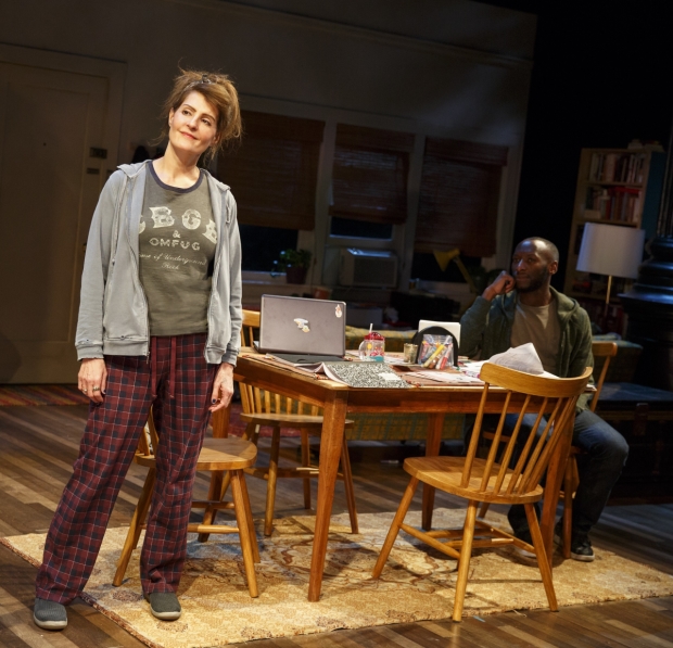 Sugar (Nia Vardalos) gives advice around her kitchen table as a supporting player (Phillip James Brannon) looks on in Tiny Beautiful Things.