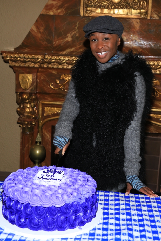 Cynthia Erivo cuts the cake.