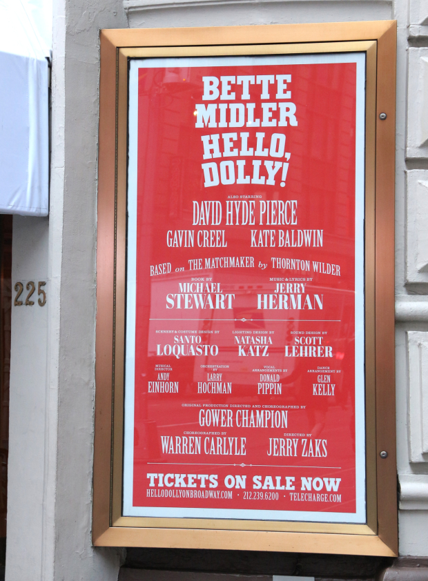 A sign outside the Shubert Theatre announcing the return of Bette Midler and Hello, Dolly! to Broadway.
