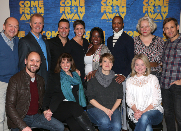 The cast members of Come From Away poses for a photo in their rehearsal room. 
