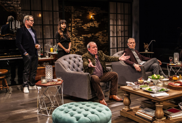 Bill (Michael Tucker, center) expresses an opinion about the government as Robert (Matthew Broderick), Jane (Annapurna Sriram), and Ted (John Epperson) listen warily in Evening at the Talk House.