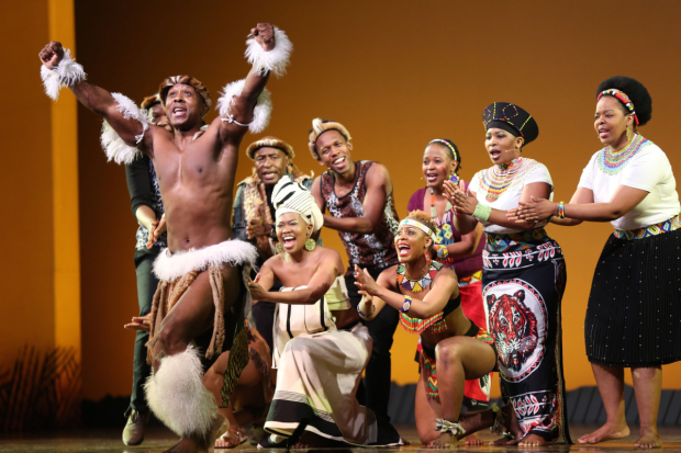 The cast of The Lion King performs at the 2015 Easter Bonnet Competition.