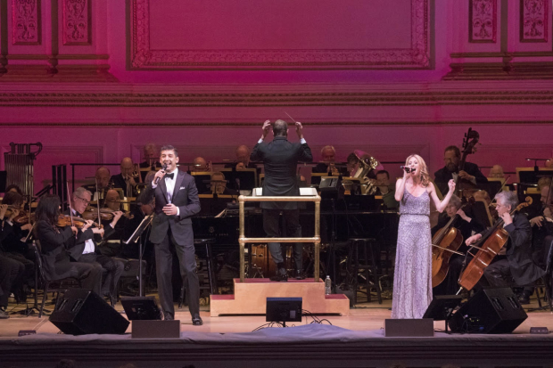 Steven Reineke (center) leads the New York Pops with special guests Tony Yazbeck (left) and Cassie Levy (right).