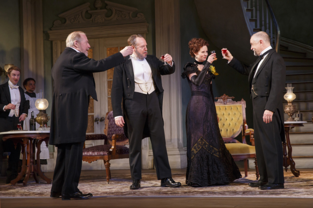 Ben (Michael McKean), Oscar (Darren Goldstein), and Regina (Cynthia Nixon) toast Mr. Marshall (David Alford) in the Broadway revival of The Little Foxes.