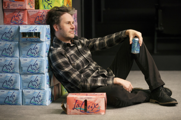Josh Hamilton helps himself to some seltzer in a scene from The Antipodes.