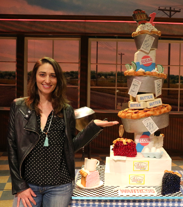 Sara Bareilles poses with the Waitress first anniversary cake.