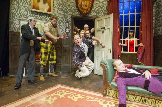 Jonathan Sayer, Henry Lewis, Dave Hearn (center falling), Greg Tannahill (on couch), and Charlie Russell (in window) star in Mischief Theatre&#39;s The Play That Goes Wrong, directed by Mark Bell, at Broadway&#39;s Lyceum Theatre.