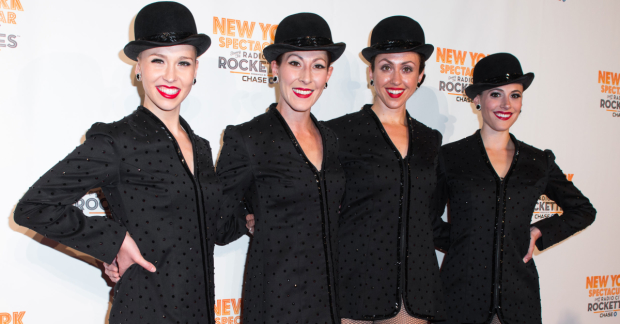 A few Radio City Rockettes pose for a photo.