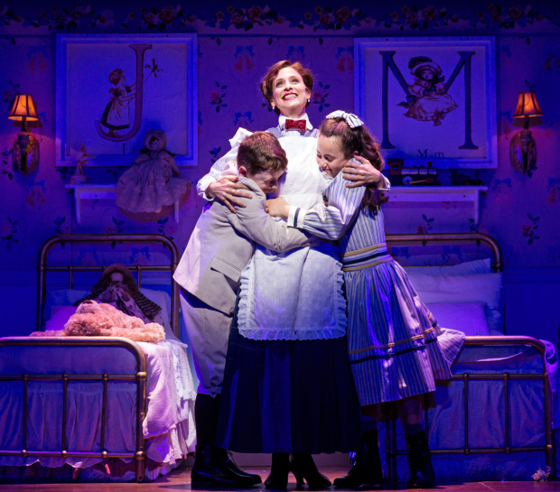 Elena Shaddow as Mary Poppins with John Michael Pitera as Michael Banks and Abbie Grace Levi as Jane Banks in Mary Poppins, directed by Mark S. Hoebee, at Paper Mill Playhouse.