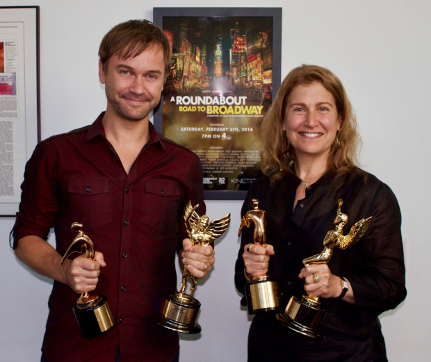 A Roundabout Road to Broadway&#39;s director Andrew Lawton and Roundabout Theatre executive director Julia Levy holding the film&#39;s four awards.