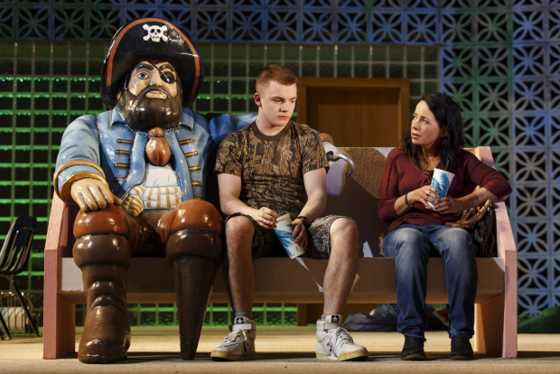 Jack DiFalco and Janeane Garofalo sit next to a pirate.
