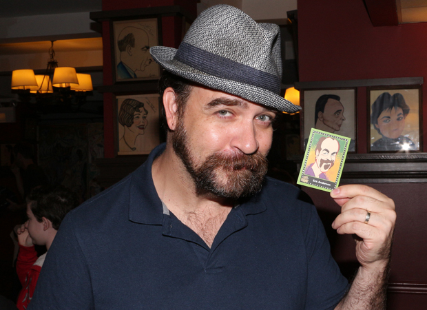 Waitress star Eric Anderson shows off his Lights of Broadway trading card.