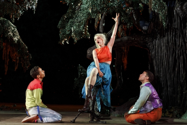  Annaleigh Ashford commands the attention of Kyle Beltran (left) and Alex Hernandez (right) in A Midsummer Night&#39;s Dream, directed by Lear deBessonet, at the Public Theater&#39;s Delacorte Theater.
