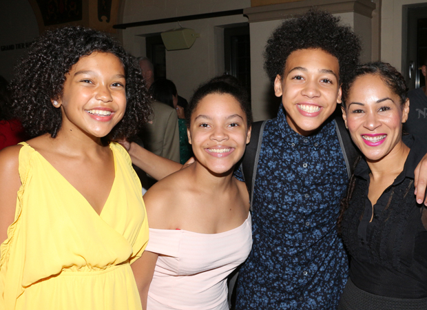 Cast members Nicole Wildy, Nanyellin Liriano, and Kenneth Cabral celebrate with choreographer Ayodele Casel.