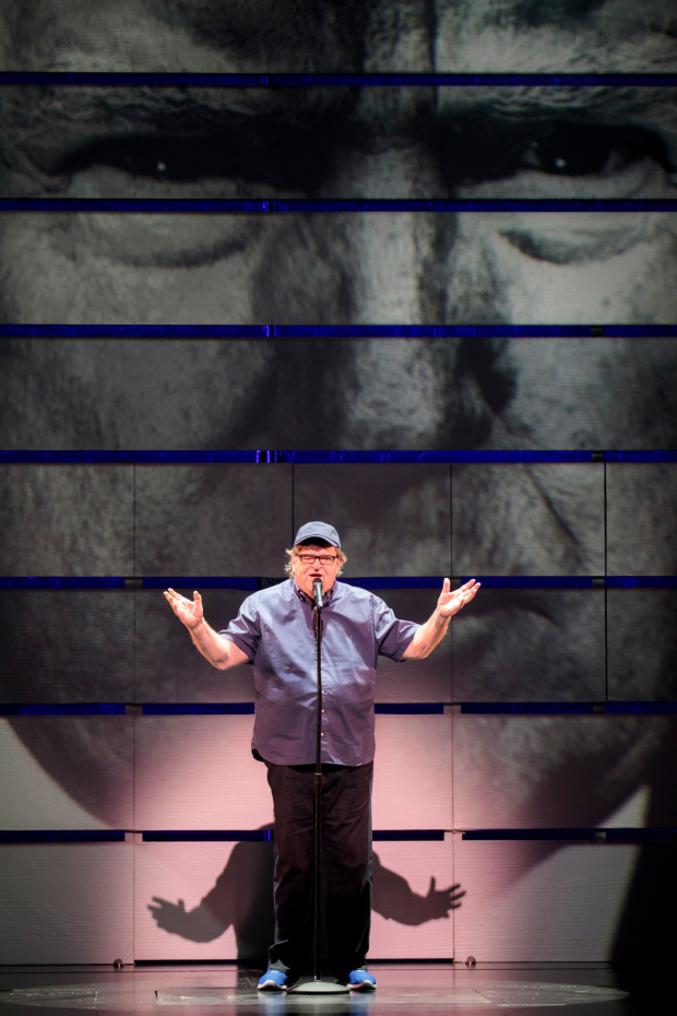Michael Moore takes the stage at the Belasco Theatre.