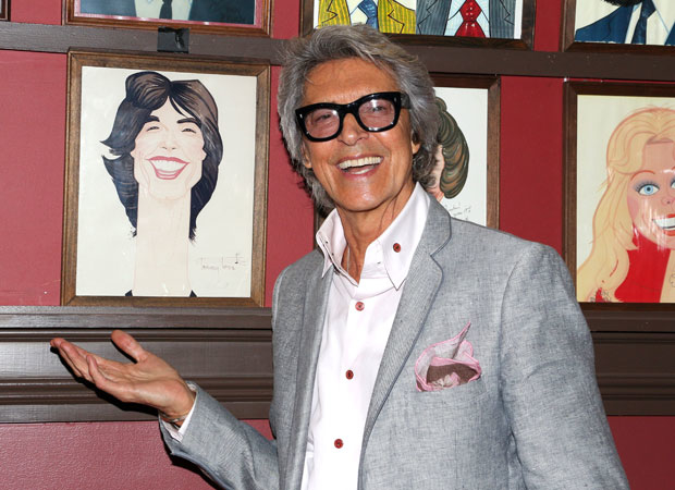 Tony winner Tommy Tune proudly shows of his portrait.