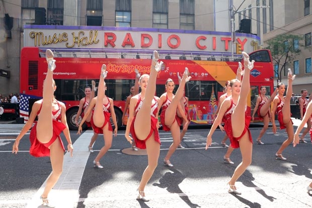 The Rockettes take Sixth Avenue to celebrate Christmas in August.