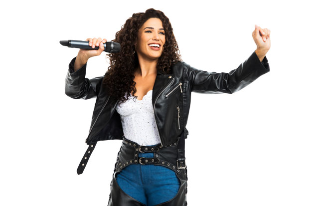 Christie Prades in a promotional image for the tour of On Your Feet!