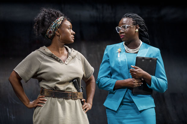 Hester (Saycon Sengbloh) is visited by The Welfare Lady (Jocelyn Bioh) in In the Blood.