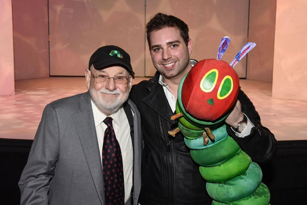 Author Eric Carle poses with Jonathan Rockefeller and The Very Hungry Caterpillar. 
