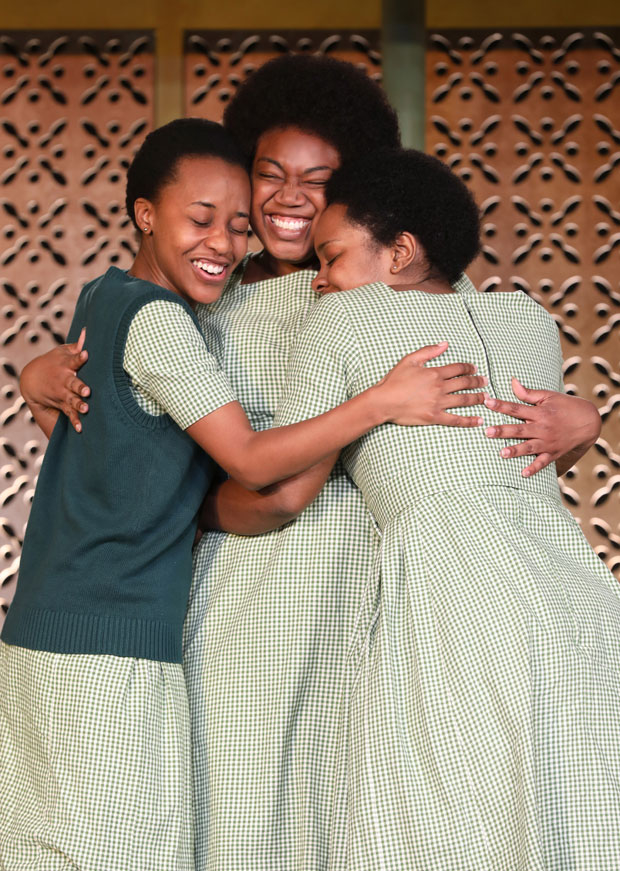 Mirirai Sithole, Abena Mensah-Bonsu, and Paige Gilbert share a hug.