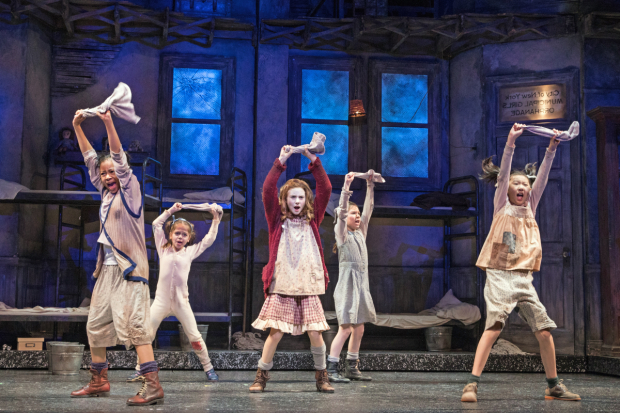 Cassidy Pry (center) as Annie, with Michelle Henderson (Duffy), Tessa Noelle Frascogna (Molly), Eve Johnson (Tessie), and Lauren Sun (July) in Annie at Paper Mill Playhouse.