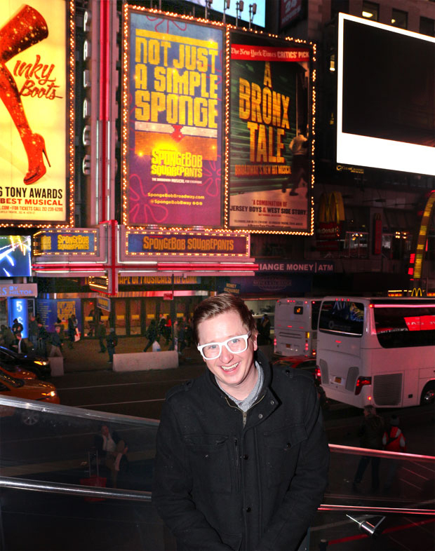 SpongeBob SquarePants book writer Kyle Jarrow poses with the musical&#39;s Broadway marquee.