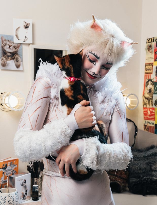 Claire Rathbun shares a hug backstage with a shelter kitten.