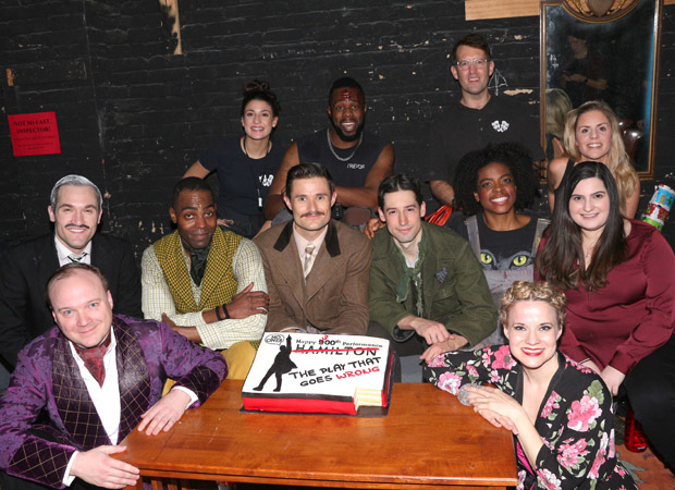 Baker Dina Jawetz (right, in maroon) gets a quick photo with the cast and her cake.