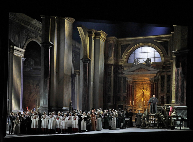 The chorus sings a Te Deum during the first act finale of Tosca at the Metropolitan Opera.