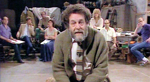 A screenshot of John Barton hosting the ITV series Playing Shakespeare.
