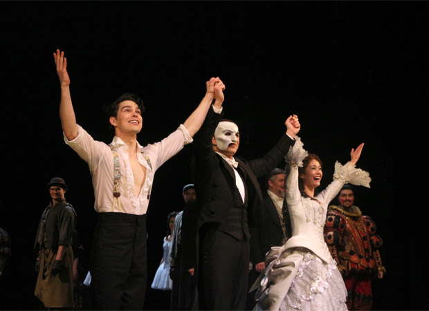 Rodney Ingram, Peter Jöback, and Ali Ewoldt take their bow during the 30th anniversary performance of The Phantom of the Opera.