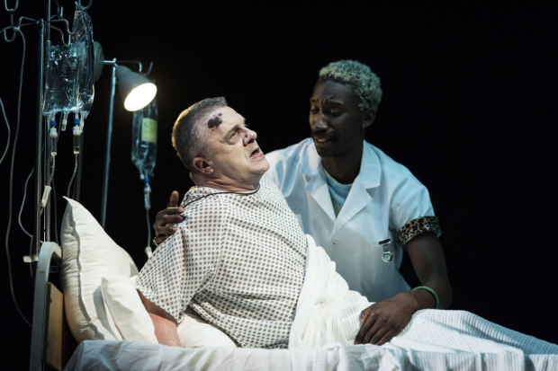 Nathan Lane (Roy Cohn) and Nathan Stewart-Jarrett (Belize) in a scene from the National Theatre production of Angels In America Perestroika 