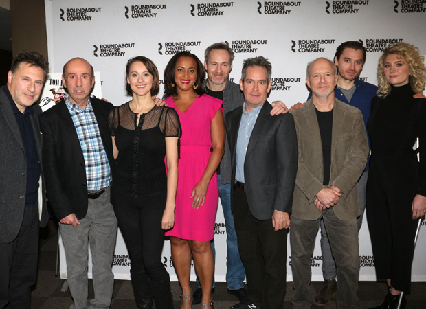 The company of Travesties meet the press.