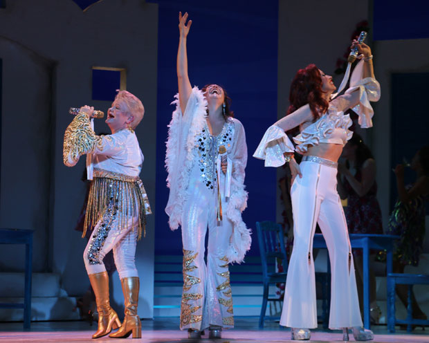 Charis Leos, Anne Brummel, and Lyn Philistine star in Mamma Mia! at Walnut Street Theatre.