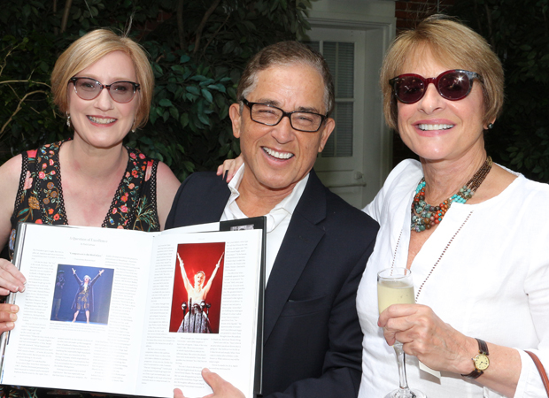 Heather Hitchens and Patrick Pacheco show Patti LuPone her section of American Theatre Wing, an Oral History.