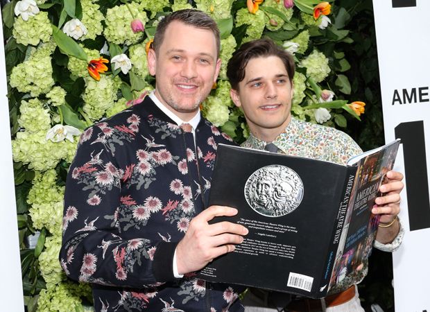Michael Arden and Andy Mientus look through the new book.