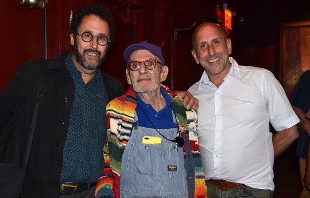 Larry Kramer (center) celebrates his birthday with playwright Tony Kushner and directo Scott Elliott.