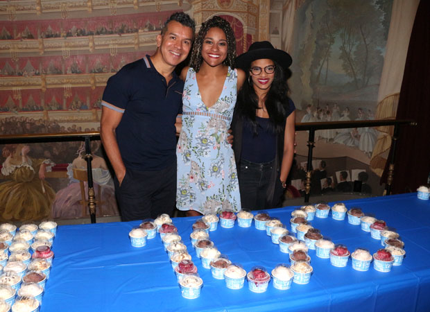 Sergio Trujillo, Ariana DeBose, and Storm Lever with cups of ice cream spelling out &quot;100.&quot;